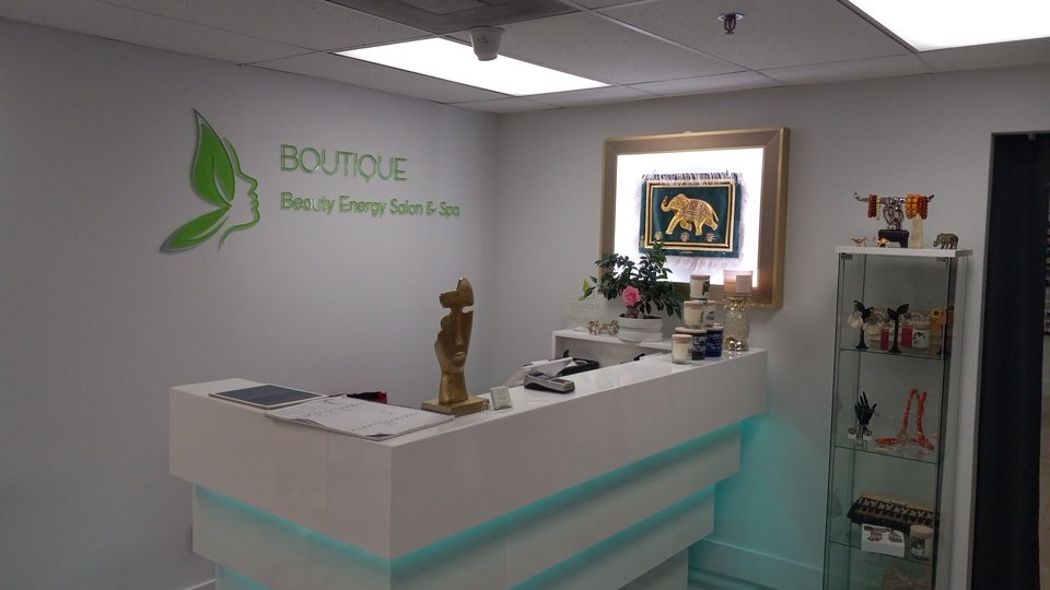 Clean, quiet salon waiting area with beverages nearby.